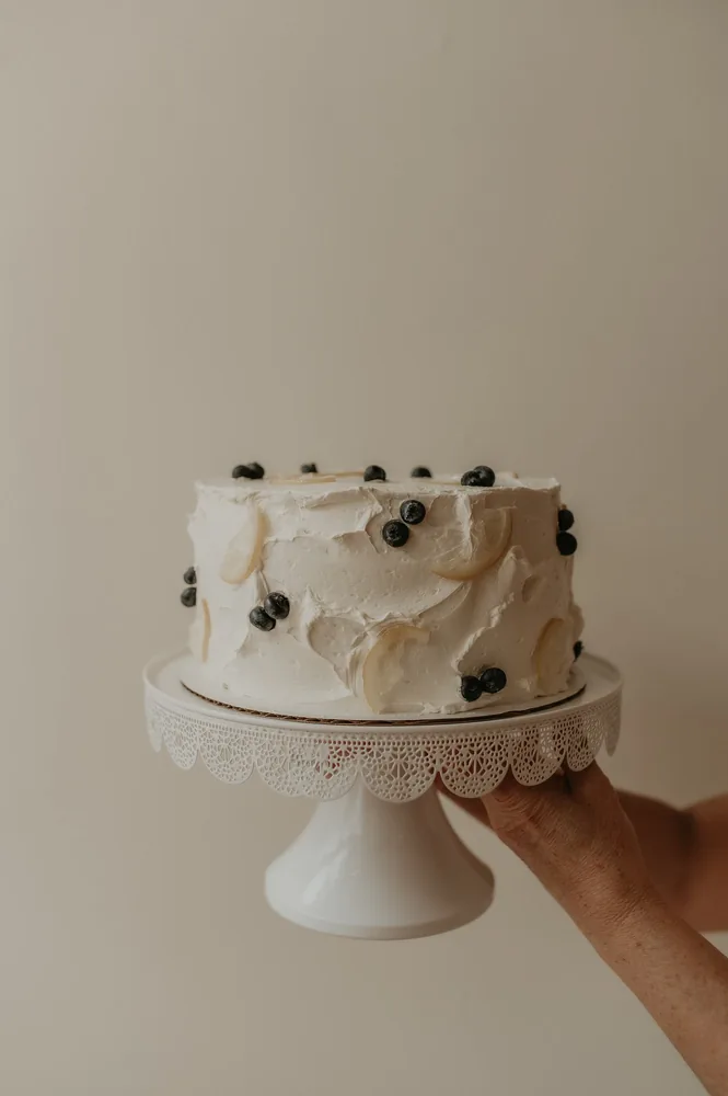 A blueberry cake on a stand